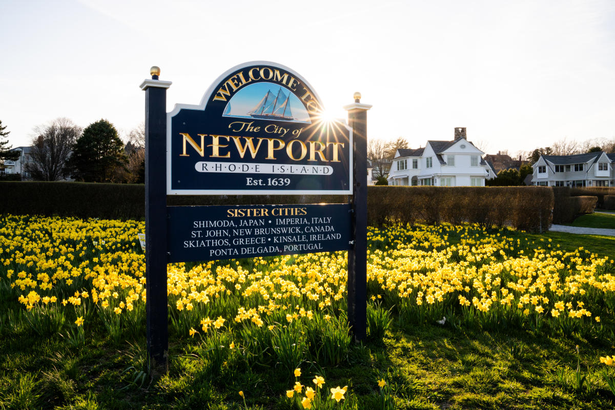 Newport Daffodil Days City of Newport Sign with Flowers and Sun