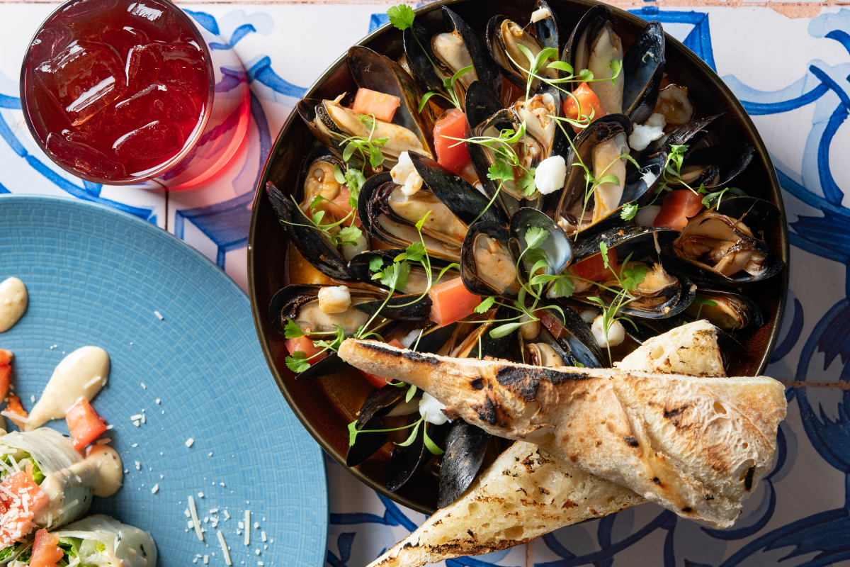 Try this bold twist on posole with mussels, hominy, and a rich, smoky broth.