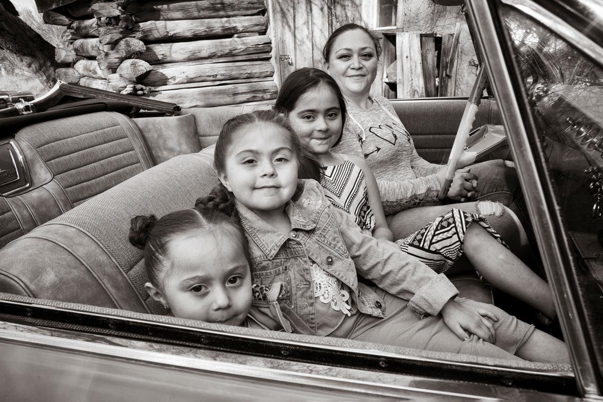 For the Chacon girls (from left, Bobbie, Heaven, and Angel) and their mother, Pam Jaramillo—posing here in their 1961 Impala at the Chimayó Museum in 2016—lowriding is a family affair. Long before any of them could drive, each girl laid claim to a family-owned lowrider of her own. Cruising with other lowriders is a regular ritual where families and friends come together to share their love of these special cars.