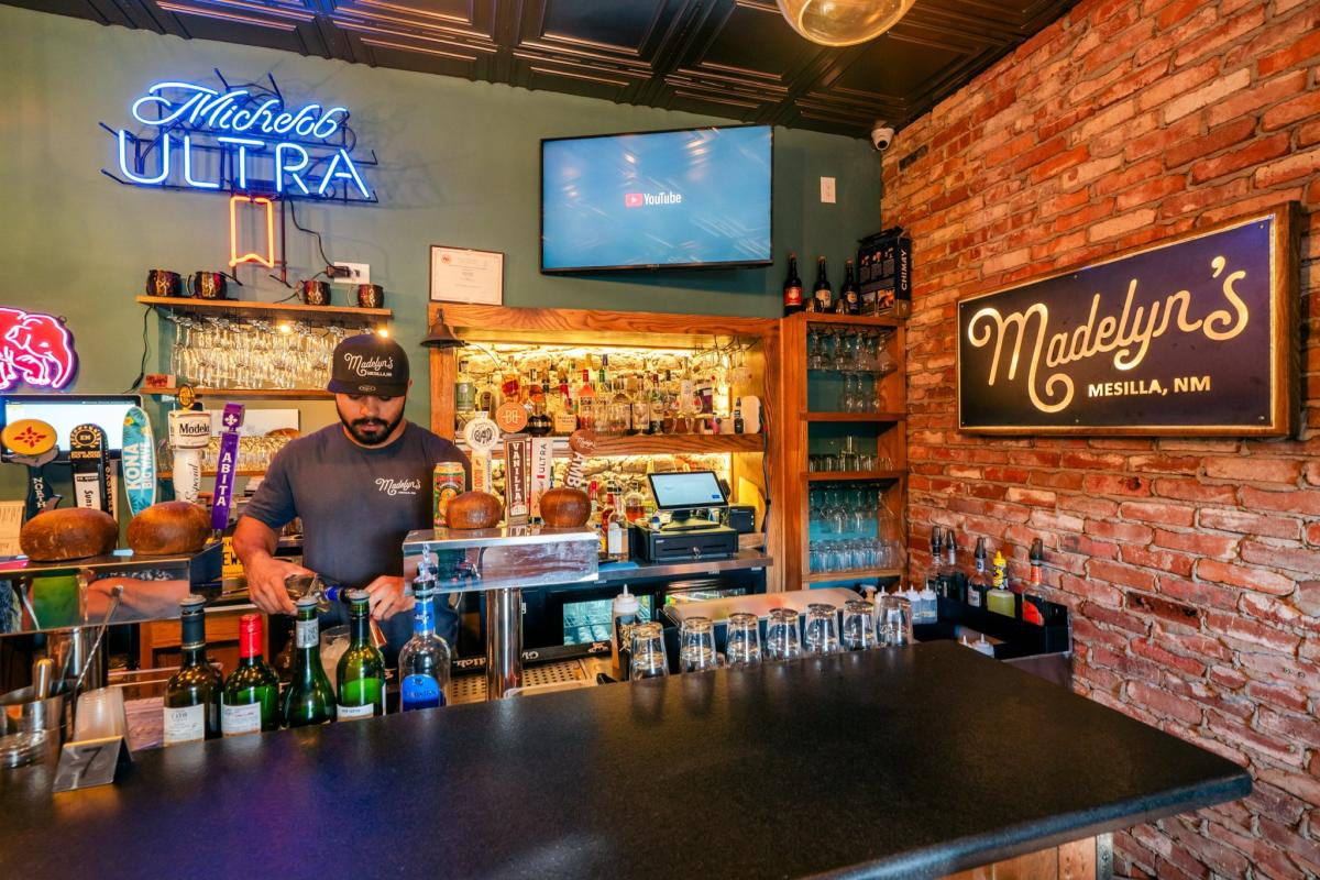Bartender serving drinks at Madelyn's in Mesilla.