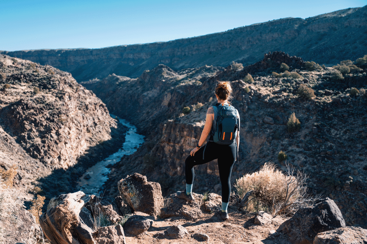 Woman hiking La Vista Verde Trail near Taos.