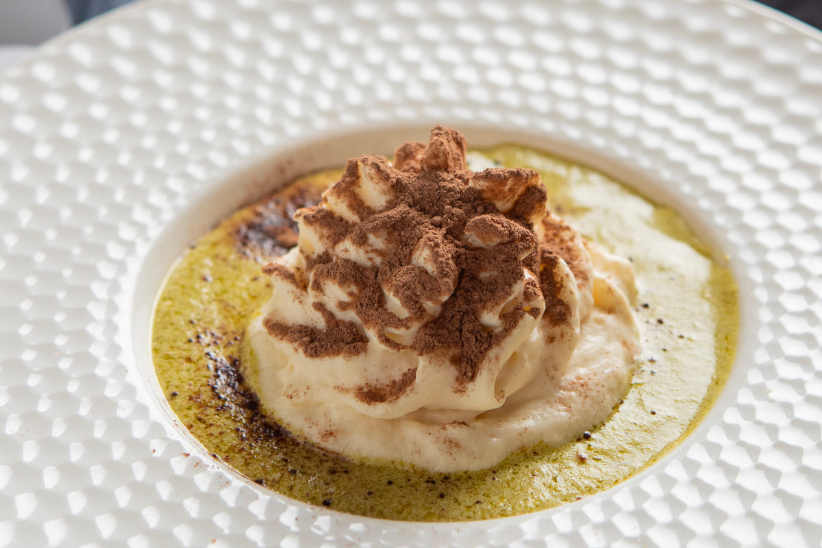 Sopa de Amor from Sazón is a rich, creamy soup blending roasted poblano peppers, blue crab, and a touch of sweetness.