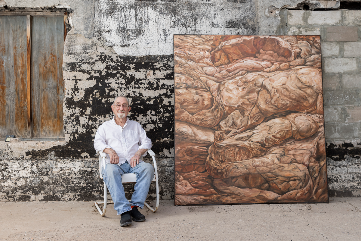 Delmas Howe strikes a pose in Truth or Consequences with "M-2," 2009, from his "Guys and Canyons" series.
