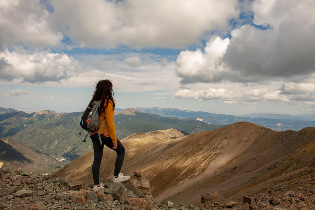 Hiker at the top of Wheeler Peak.