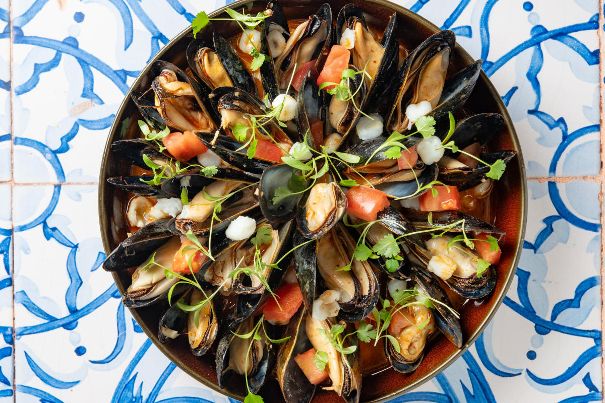Taste mussels posole, a bold seafood twist on a New Mexico classic.