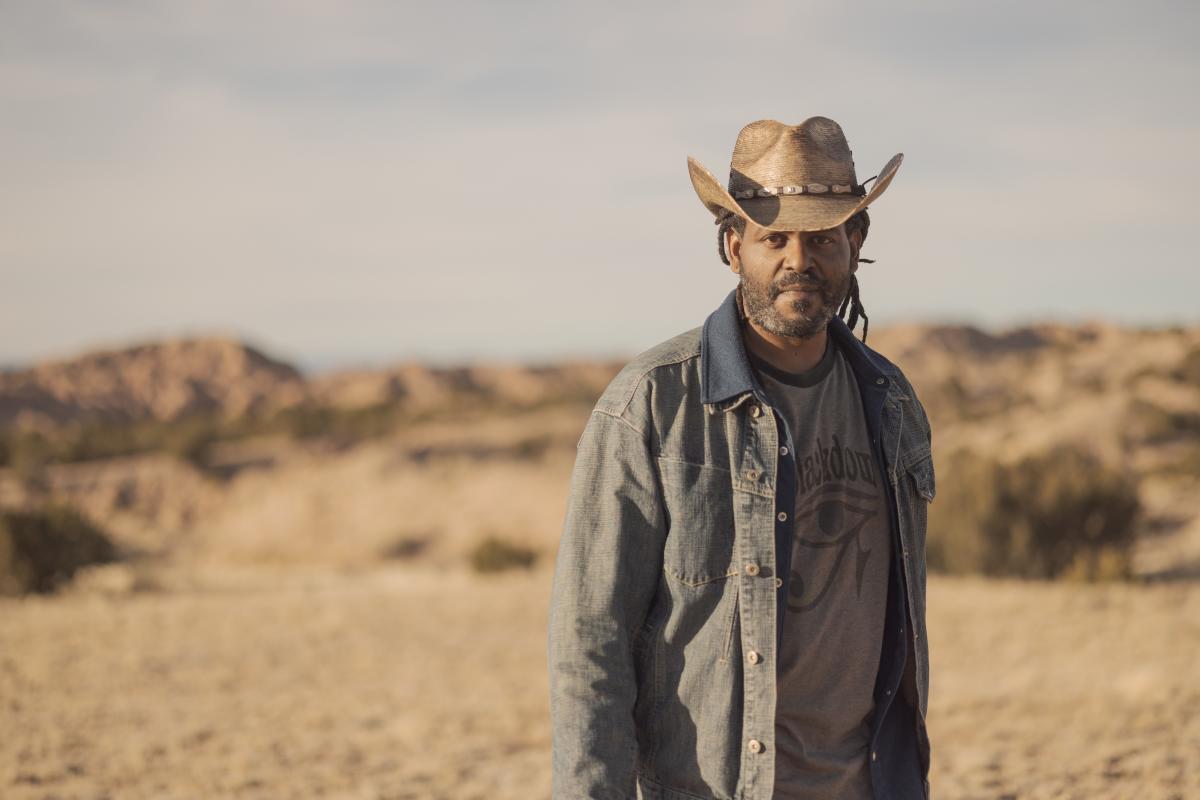 Timothy E. Nelson standing in the desert.