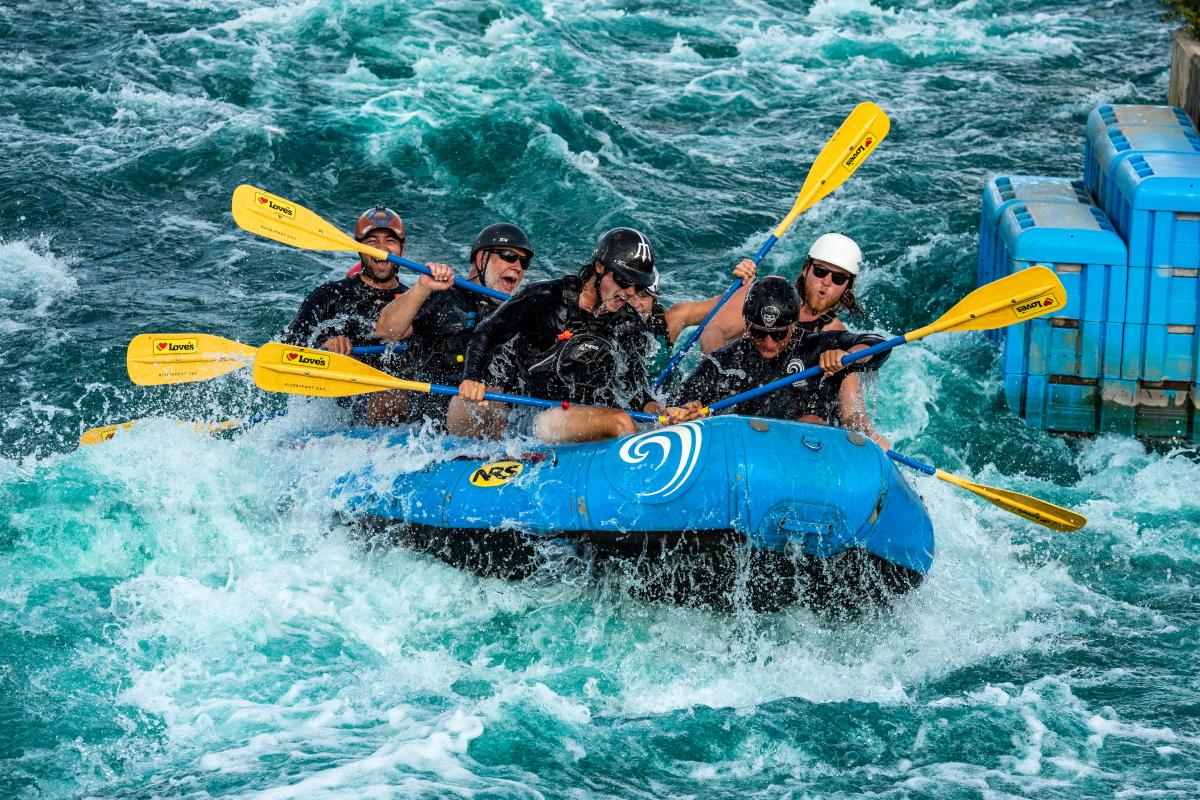 A group water rafts at Riversport