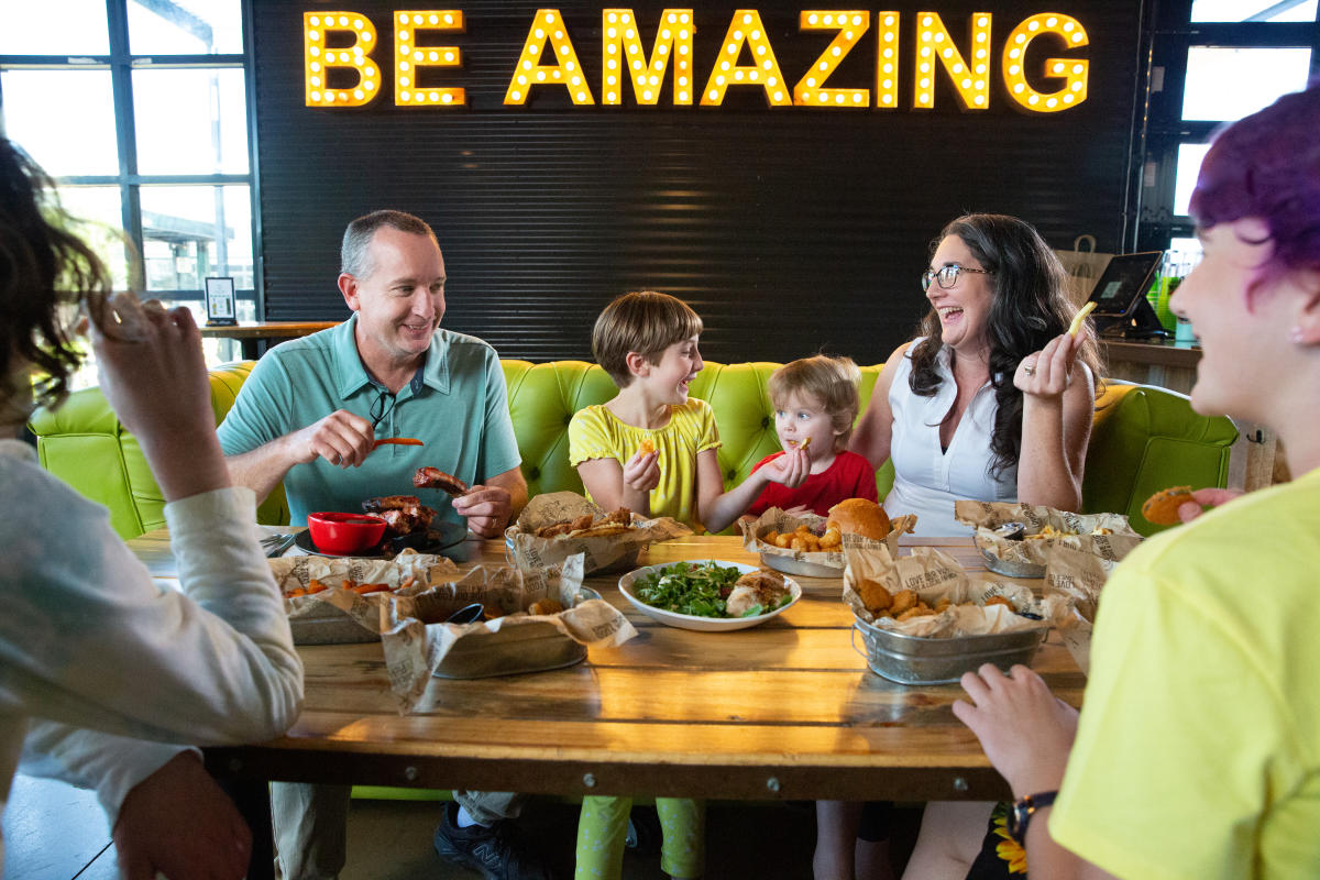 family eating at Chicken N Pickle