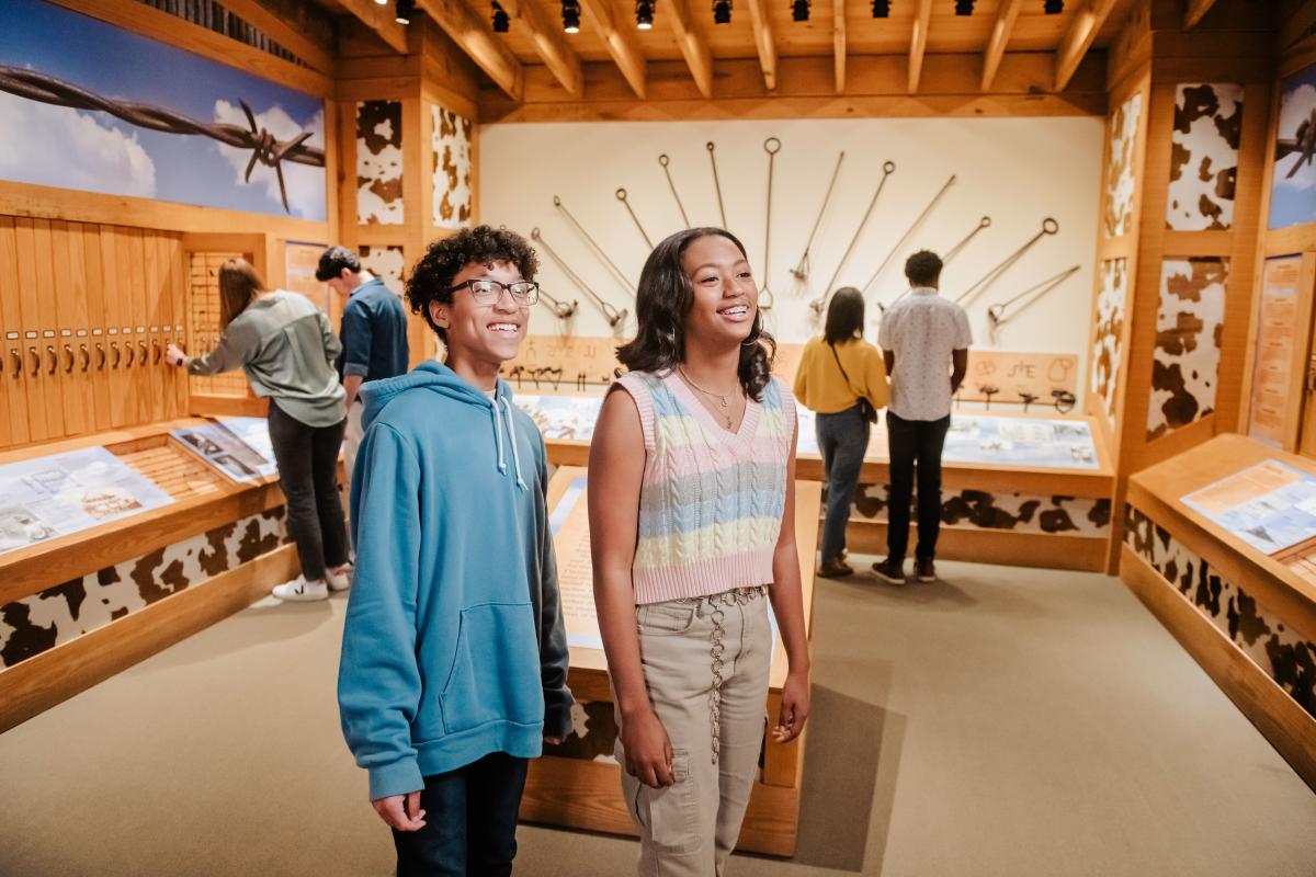 Two people walking in an exhibit at the National Cowboy and Western Heritage Museum in Oklahoma City