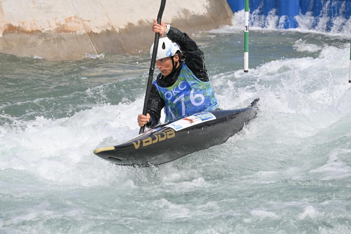 Woman racing in kayak slalom race at Riversport
