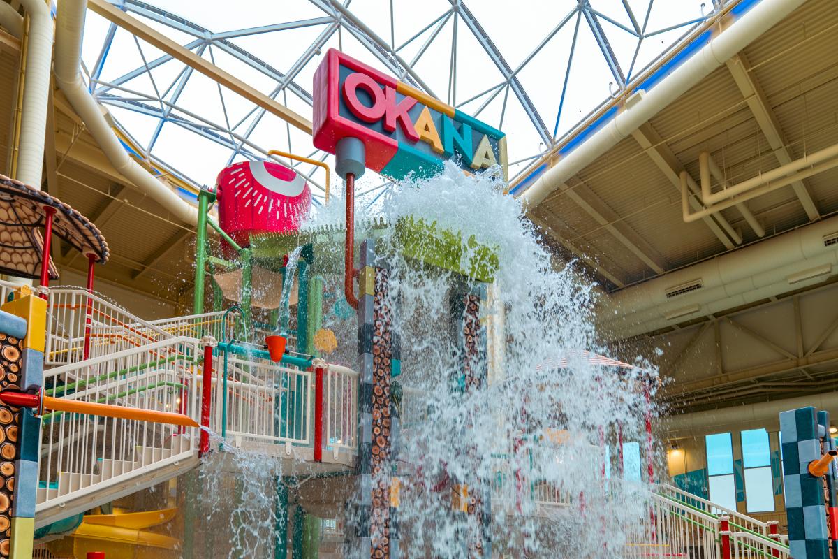 Water spilling from a huge bucket at OKANA's Indoor Waterpark