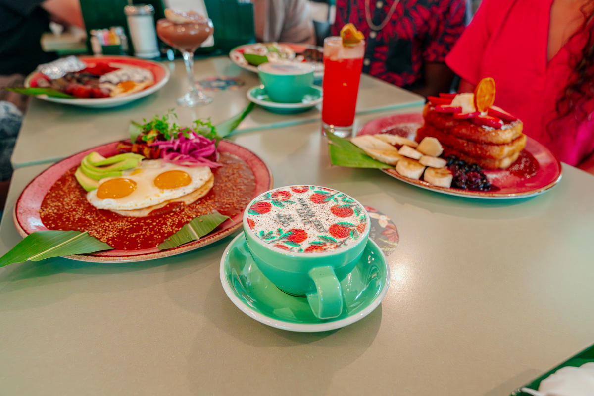 Table full of food and coffee at Cafe Kacao