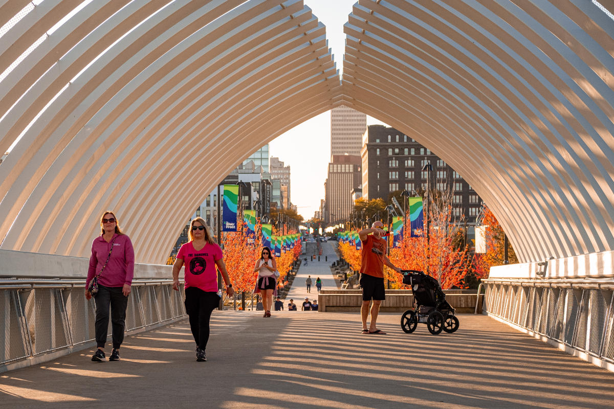 People walking on Farnam Pier at Heartland of America Park at The RiverFront.