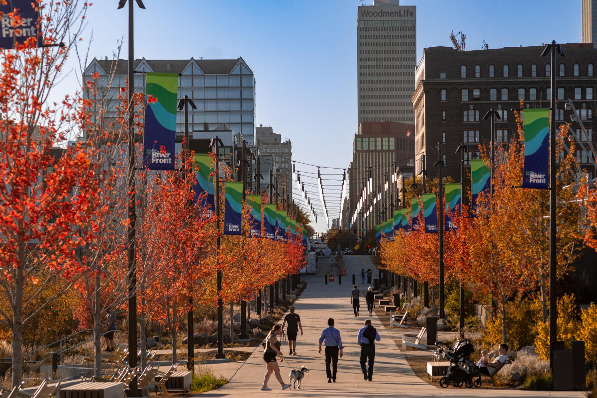 People walking along a path at The RiverFront in the fall.