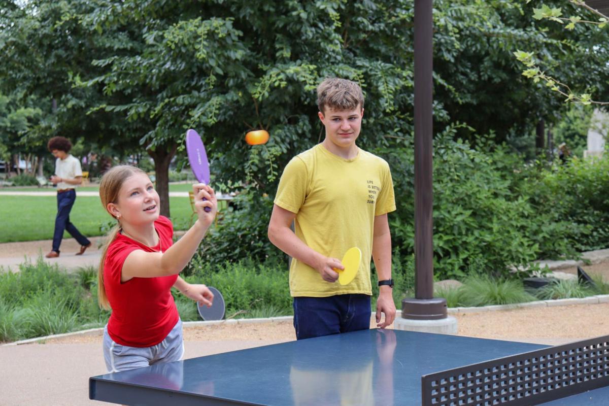 Teenagers playing ping pong at The RiverFront.