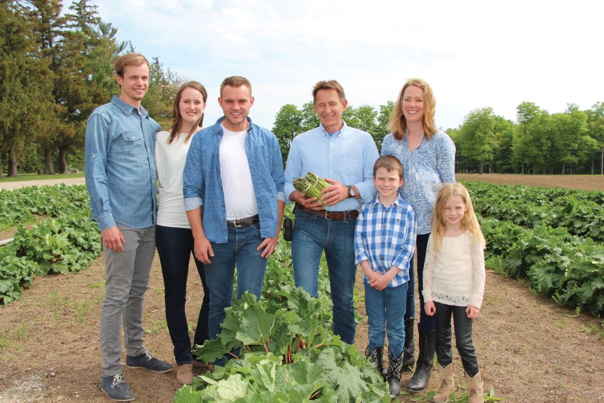 family harvesting the crop
