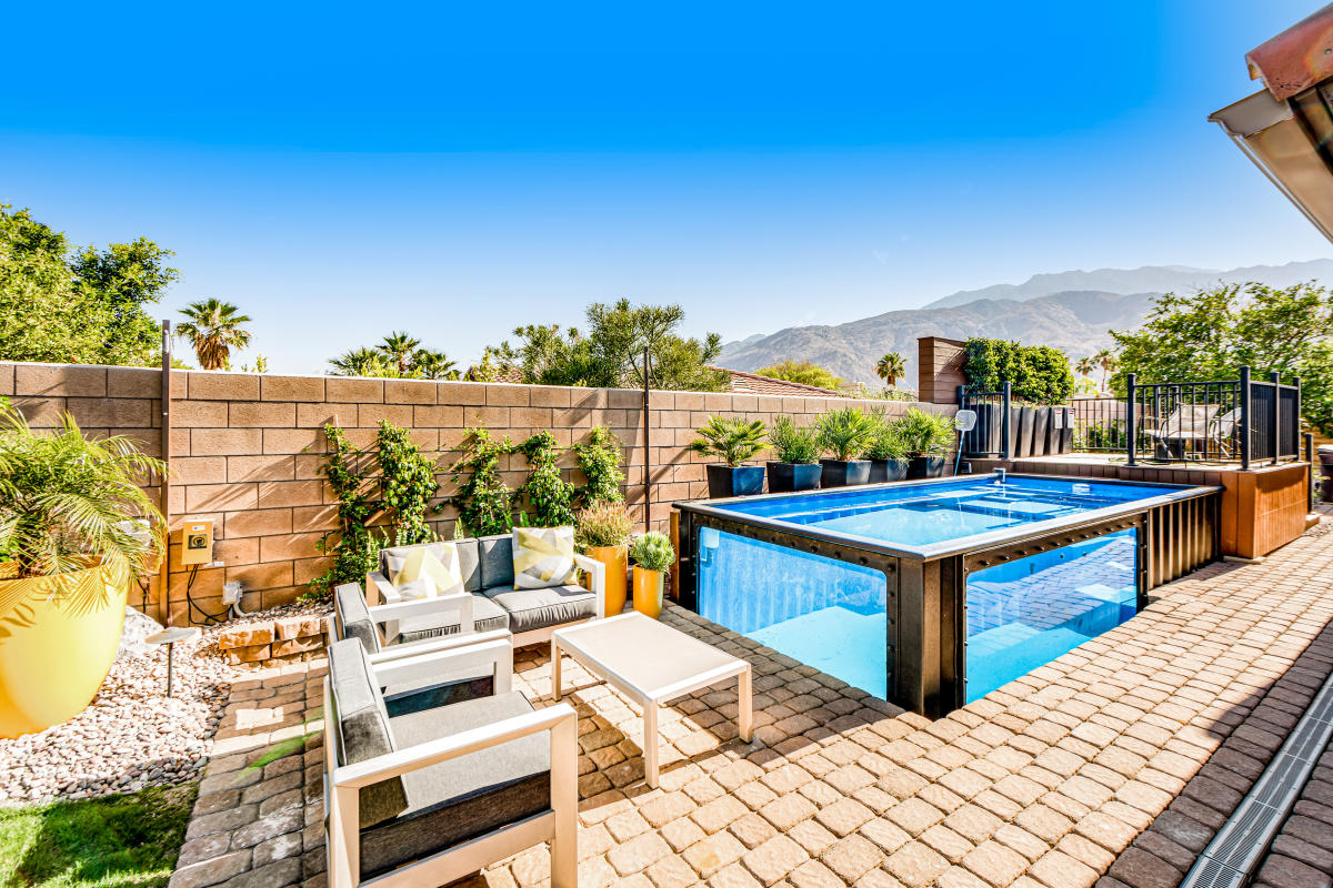 Beautiful glass walled pool with mountains in the distance