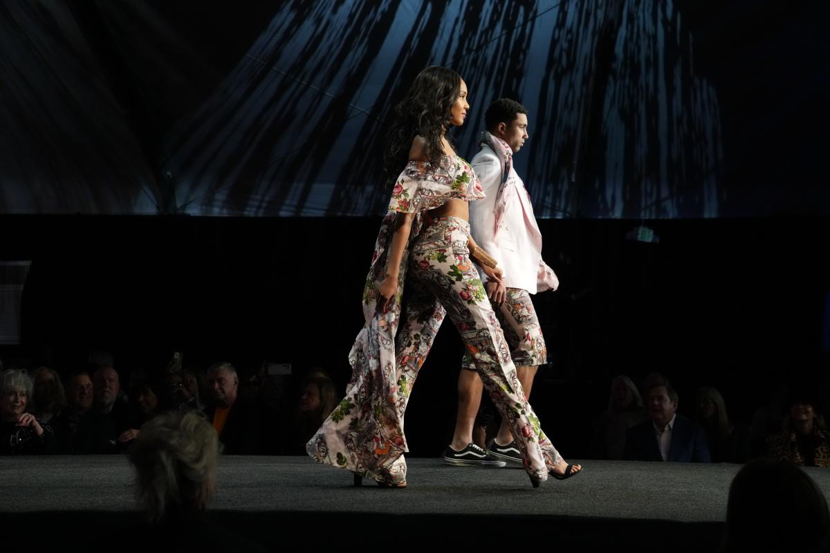 Two models walk down the runway during the 2023 Fashion Week El Paseo event.