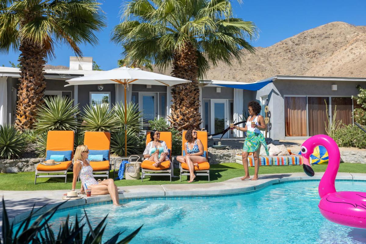 Girls relaxing poolside at a vacation rental.