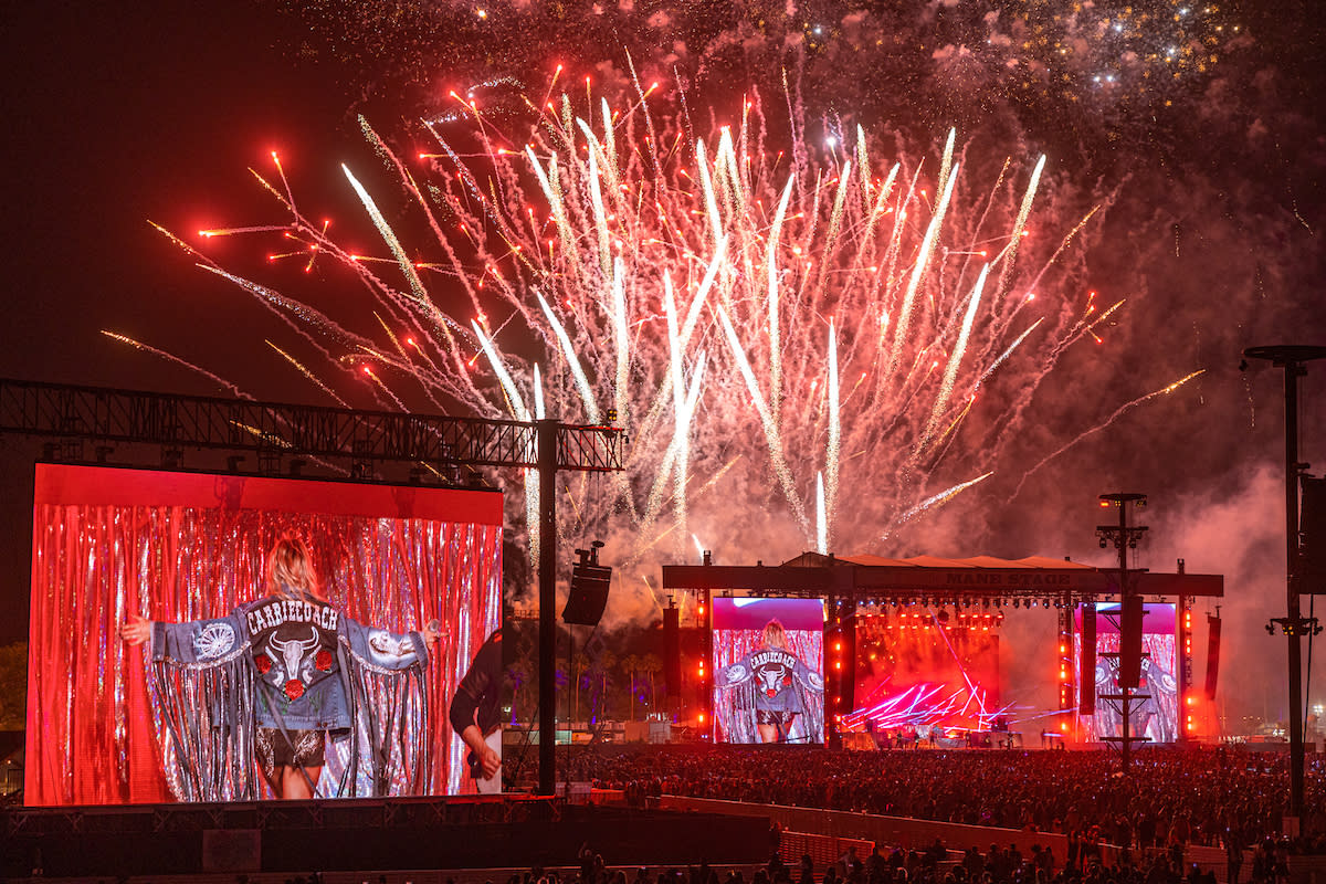 Fireworks and Carrie Underwood on screens during Stagecoach 2022.