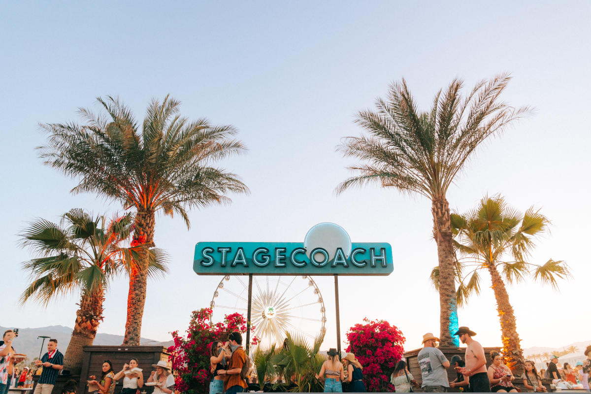 The Stagecoach sign on the festival grounds surrounded by Palm Trees.