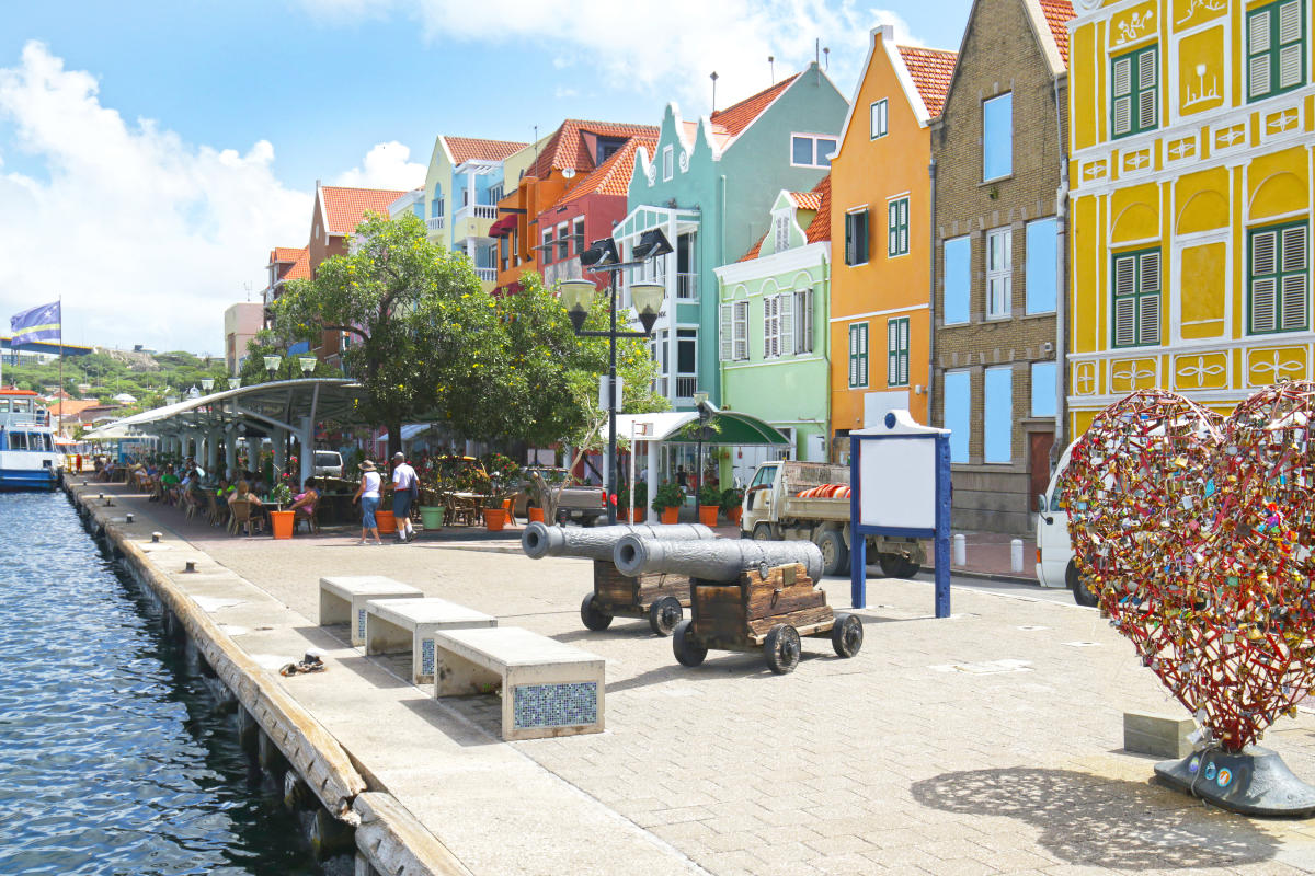 Waterfront buildings with outdoor cafes, heart shape Love locks in Curacao