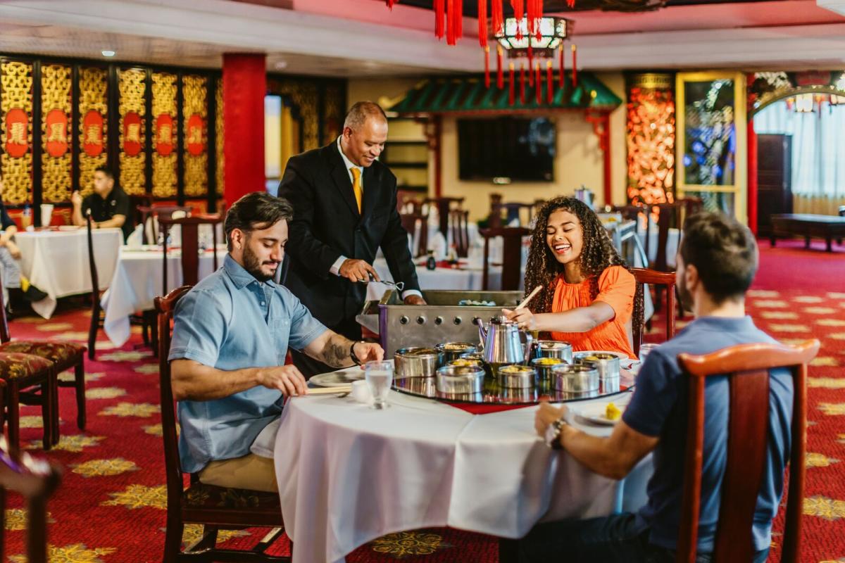 Group of friends having chinese dumplings at popular restaurant in Panama City