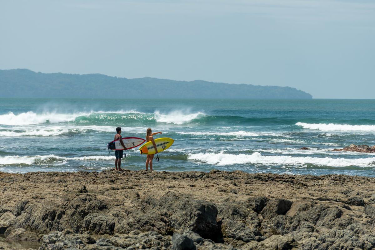 Surfers at Santa Catalina Beach, Veraguas Province