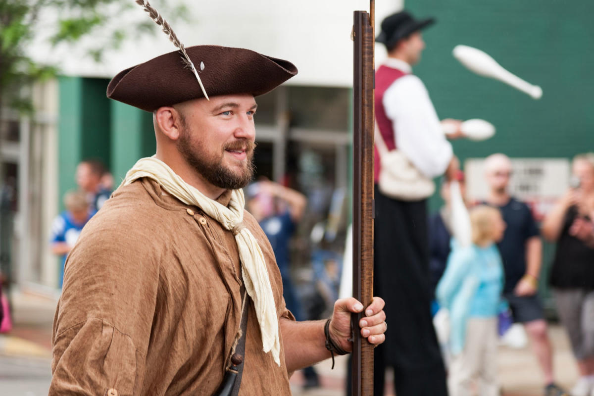 a person holding muzzle gun at Whiskey Rebellion Festival