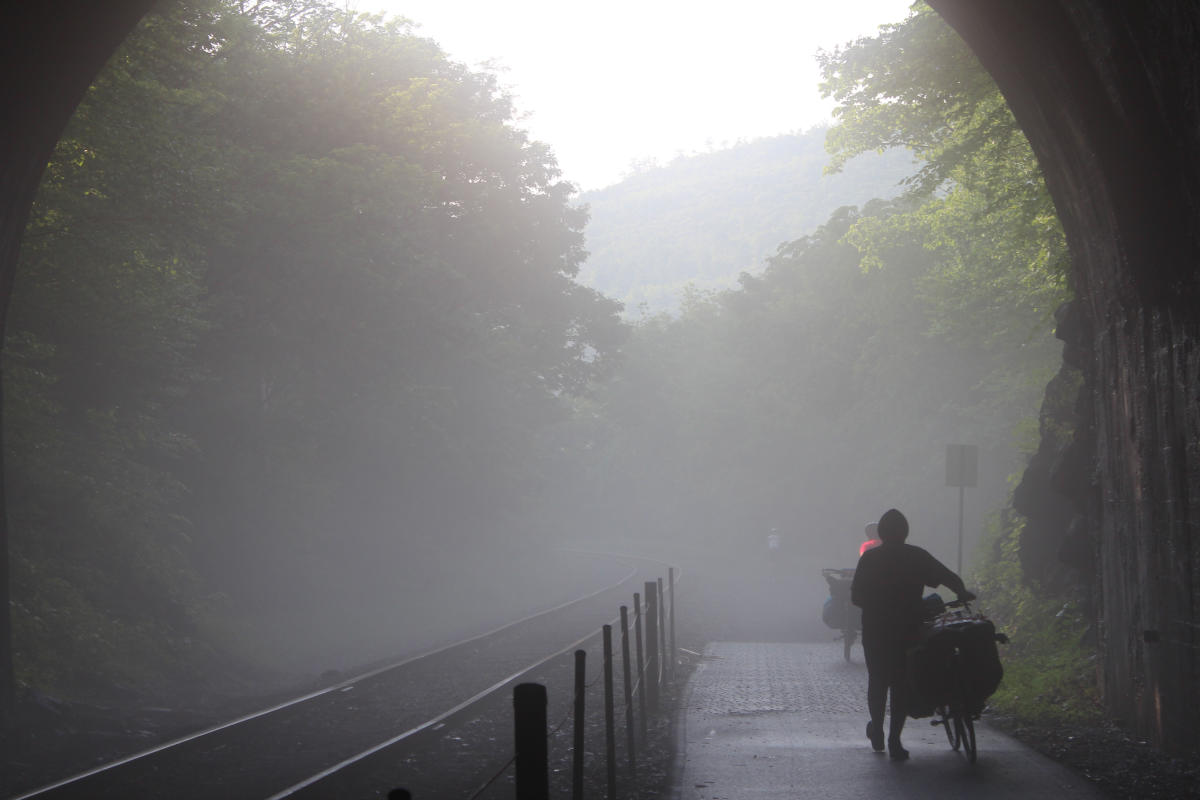 biking next to rail tracks early morning fog