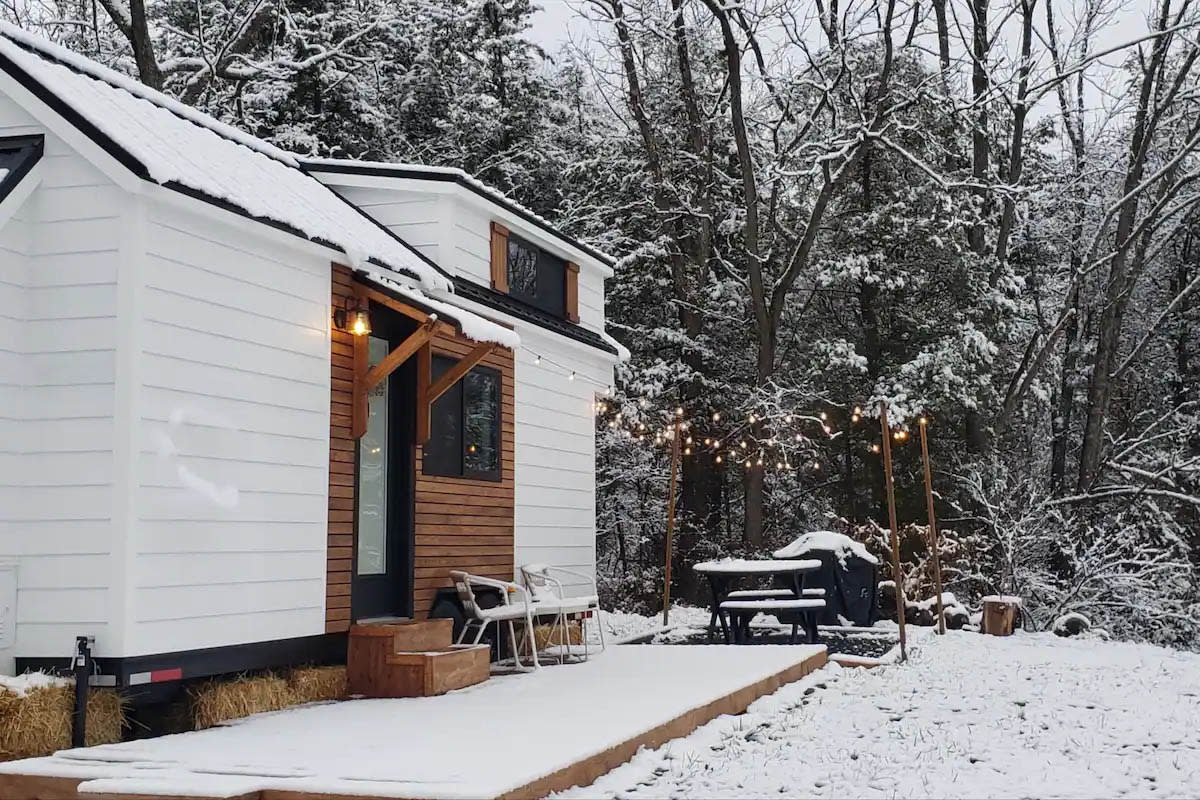 Cozy Tiny Home Cottage covered in snow