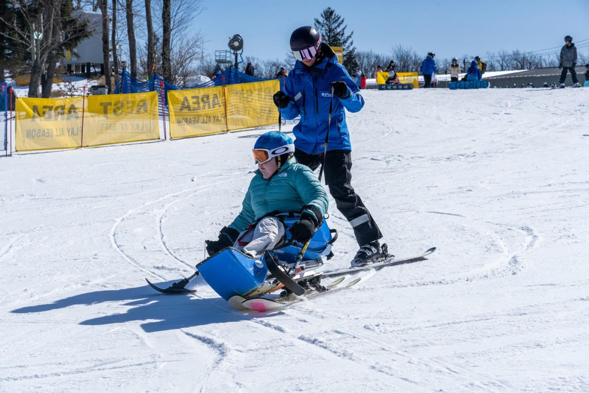 two adults skiing