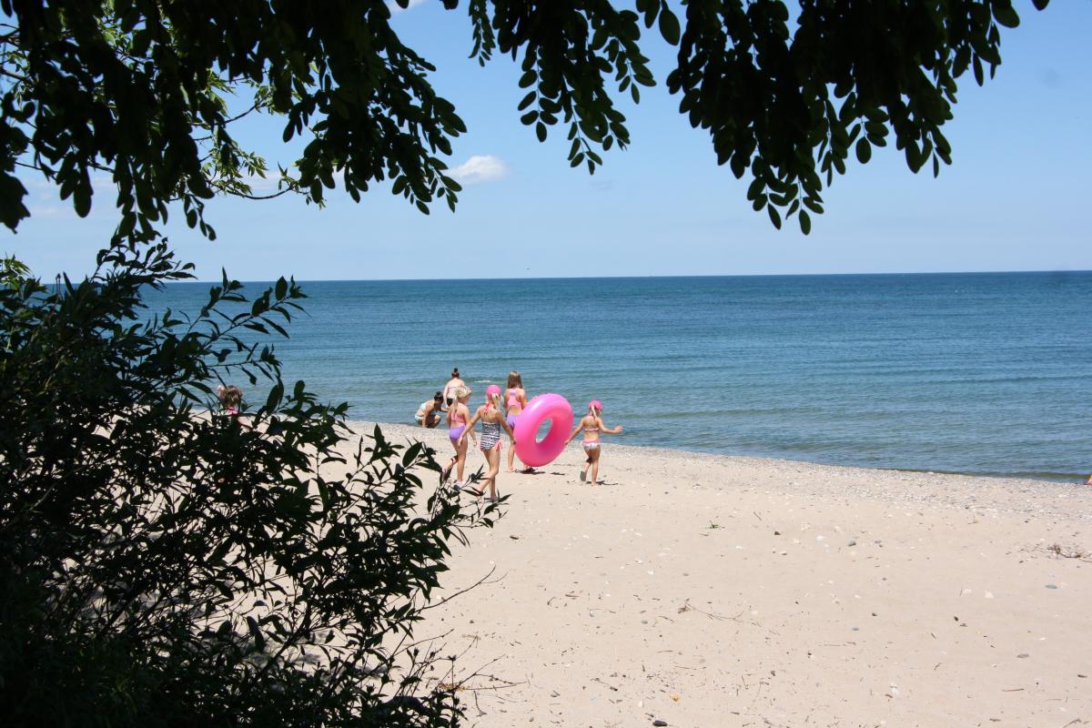 Carol Beach Lake Michigan with family and pink floaty