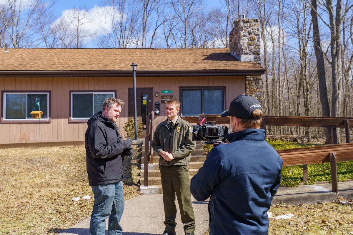 Jim and Park Manager Justin Waid talk in front of the park office