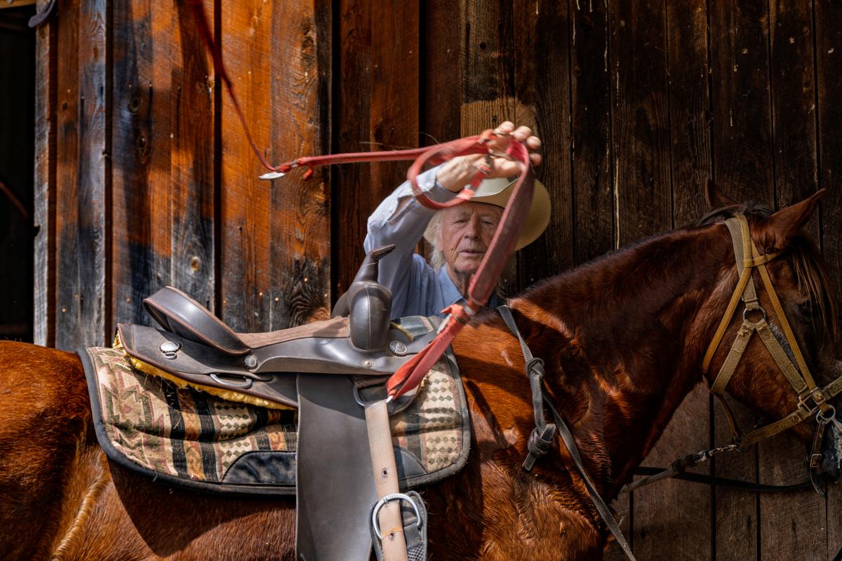 Owner Mick Mertz of Daisy Field Farm gets ready to ride