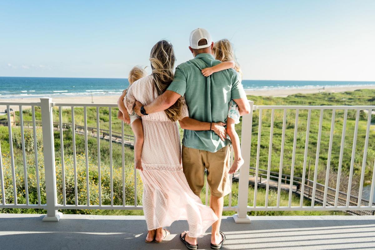 couple-balcony-beach view-condo