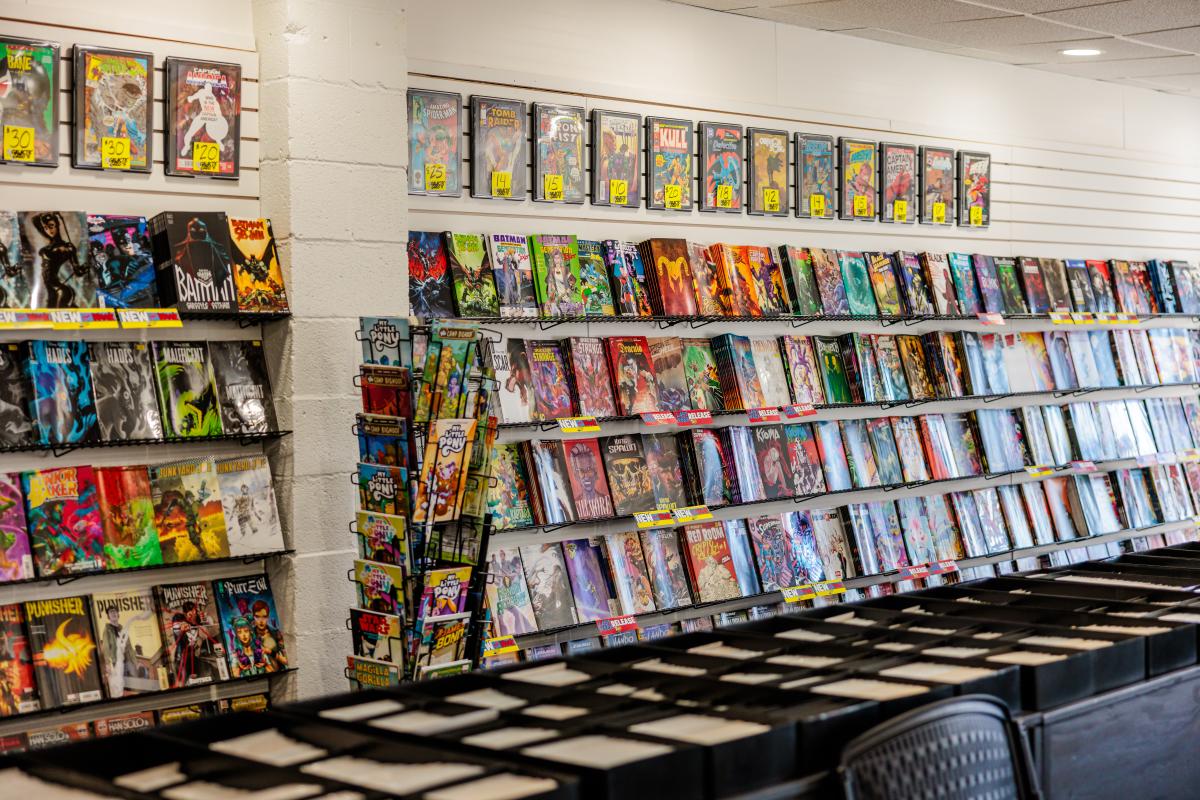 A retail wall filled with colorful comic books.
