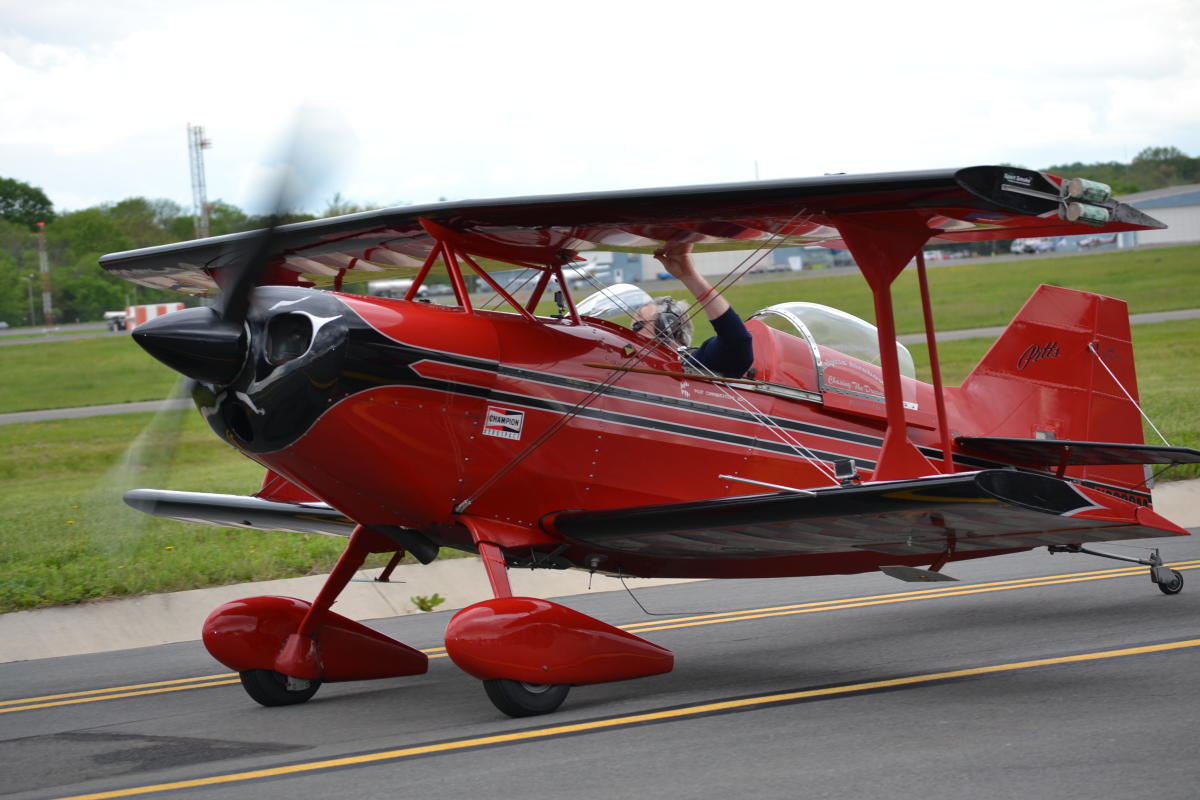 Red airplane on landing strip at Manassas Air Show