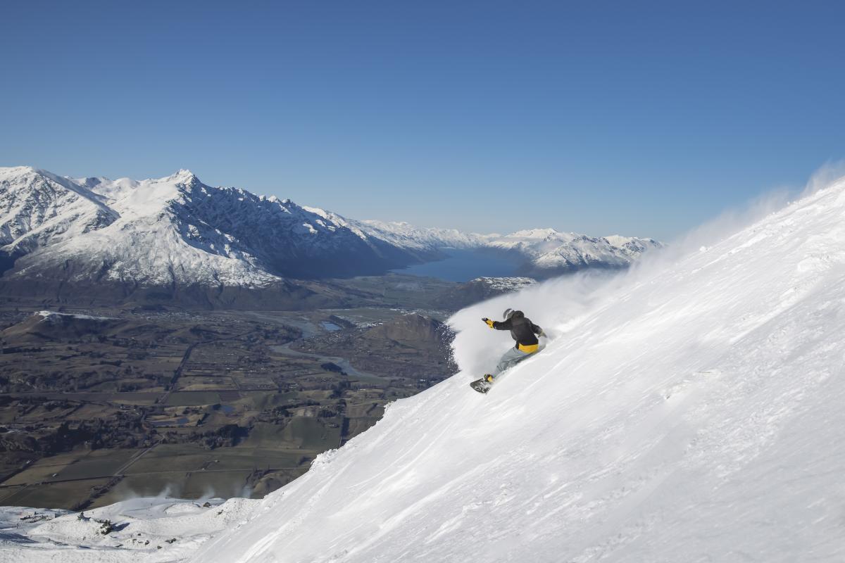 Man snowboarding at Coronet Peak Ski Area