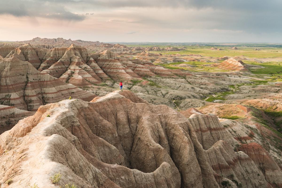 Woman walking on trail in Badlands National Park