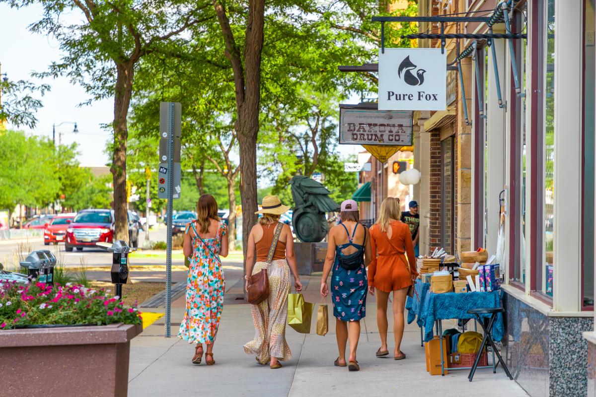 group walking the sidewalks and shopping in downtown rapid city