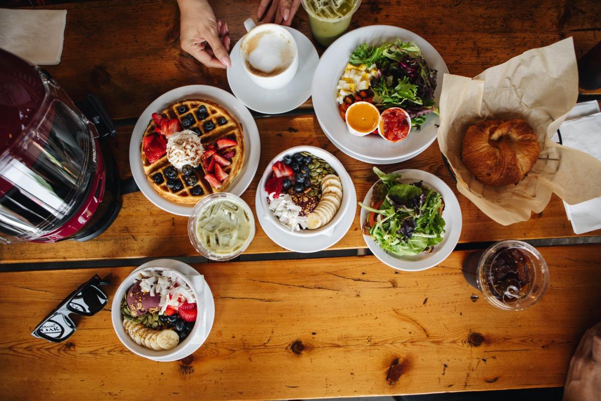 breakfast spread from harriet and oak on a table with a bike helmet
