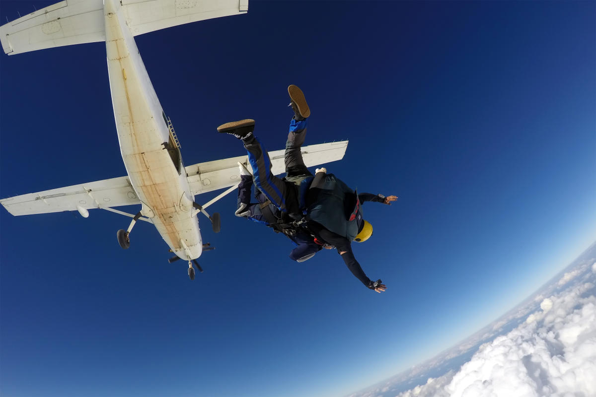 Two skydivers jumping out of a airplane in Perris, CA