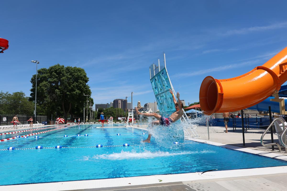 Boy going down pool slide at Soldier's Field Pool