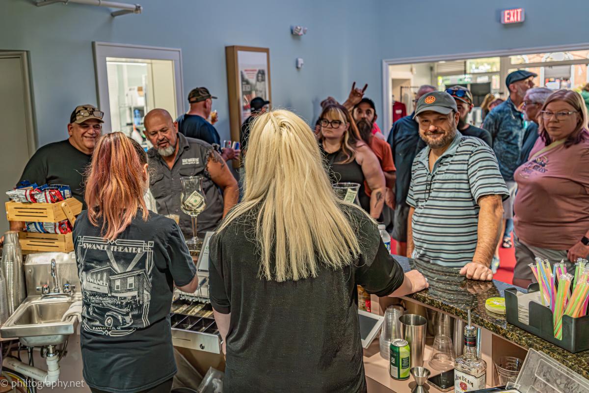 Crowd at bar at the Swanee Theatre