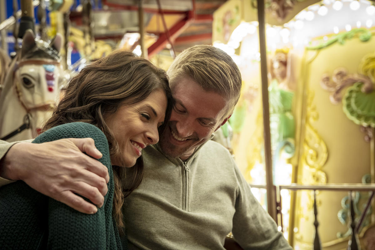 Man and Woman on Carousel at Celebration of Lights in Kannapolis