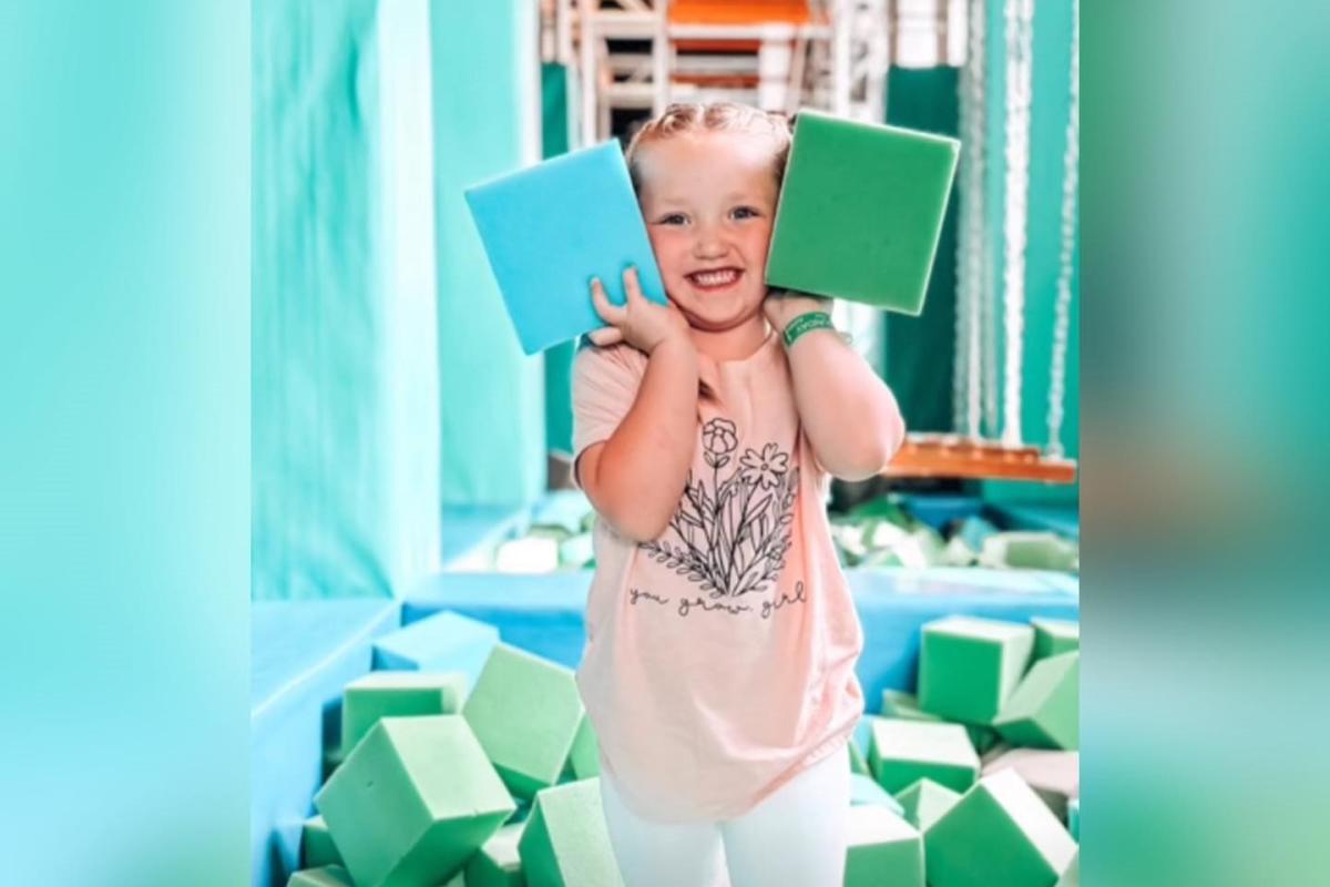 Girl playing with foam cubes