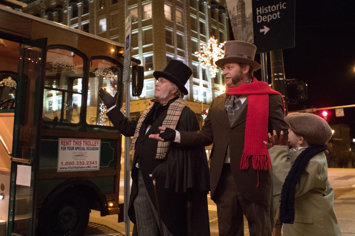 Actors performing Christmas Carol in Downtown