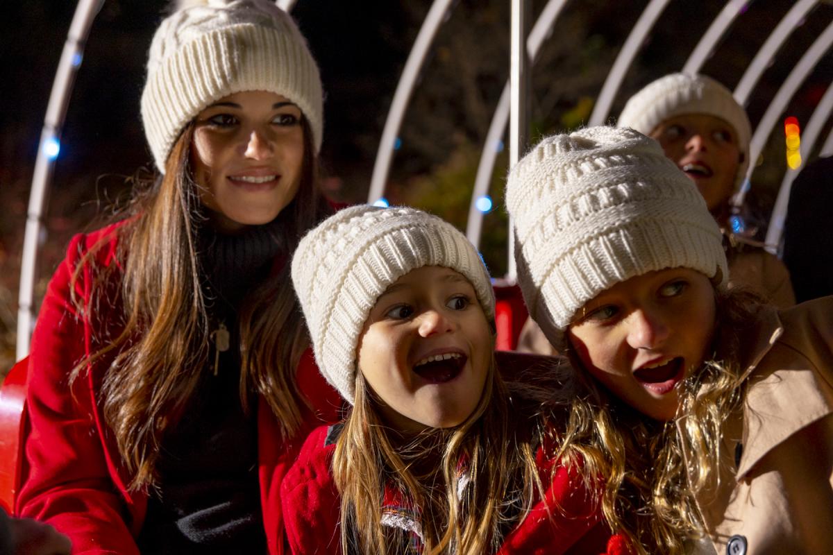 Girls looking at Christmas lights in winter attire