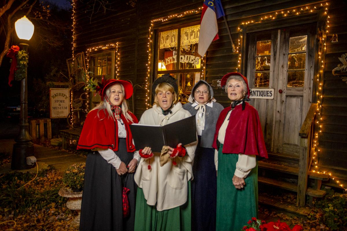 Carolers performing outside in front of store